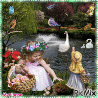 Les enfants avec cygnes et oiseaux à la fontaine