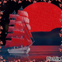 Navire avec des voiles rouges dans le coucher de soleil.
